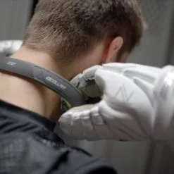 Q-Collar -Men's Lacrosse Sales Store sowers putting on q collar